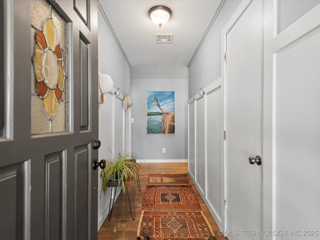 105 Quail Creek Ln, Skiatook, OK 74070 - corridor featuring wood finished floors and ornamental molding