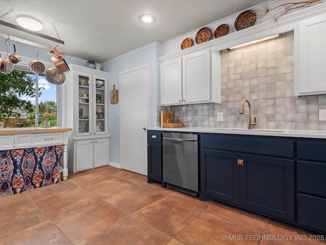105 Quail Creek Ln, Skiatook, OK 74070 - kitchen featuring stainless steel dishwasher, blue cabinets, backsplash, crown molding, and light countertops