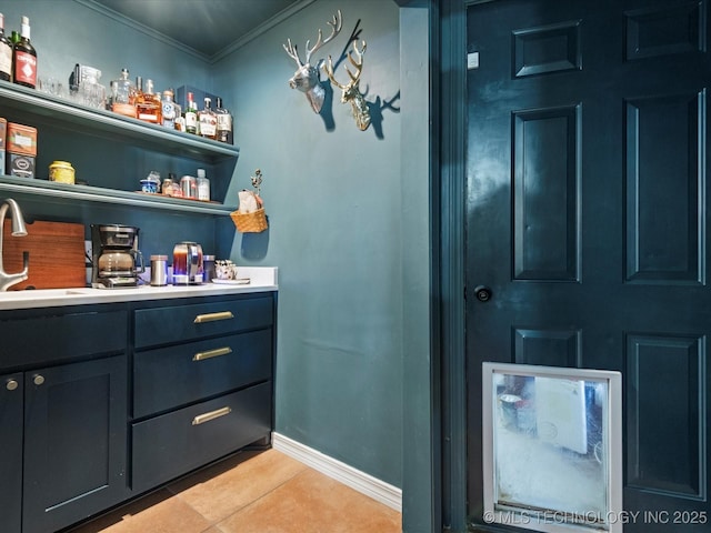 105 Quail Creek Ln, Skiatook, OK 74070 - indoor bar with light tile patterned floors and ornamental molding
