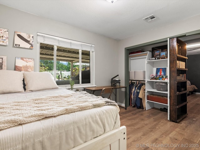 105 Quail Creek Ln, Skiatook, OK 74070 - bedroom with wood finished floors and a closet