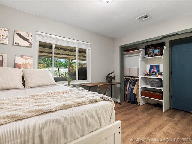 105 Quail Creek Ln, Skiatook, OK 74070 - bedroom with wood finished floors and a closet