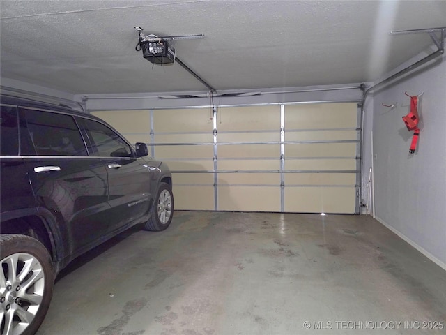 76654 S 4695, Stilwell, OK 74960 - garage featuring a garage door opener and baseboards