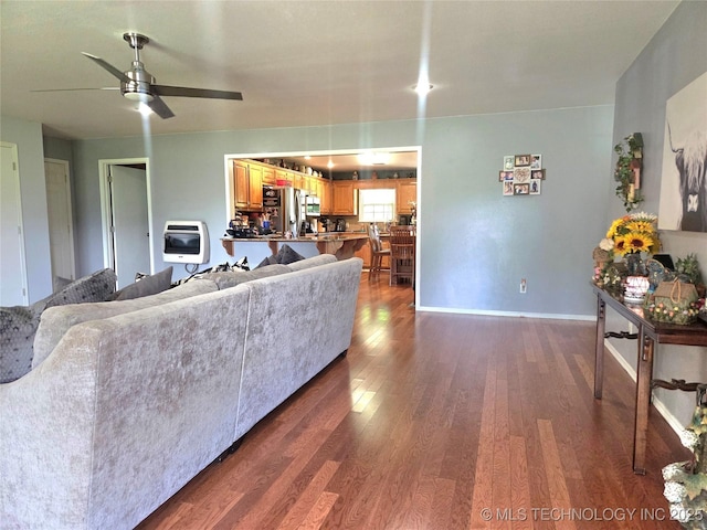 76654 S 4695, Stilwell, OK 74960 - living room featuring a ceiling fan, dark wood-style flooring, and heating unit