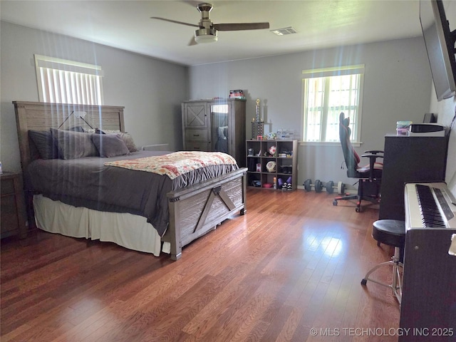76654 S 4695, Stilwell, OK 74960 - bedroom with wood finished floors and ceiling fan