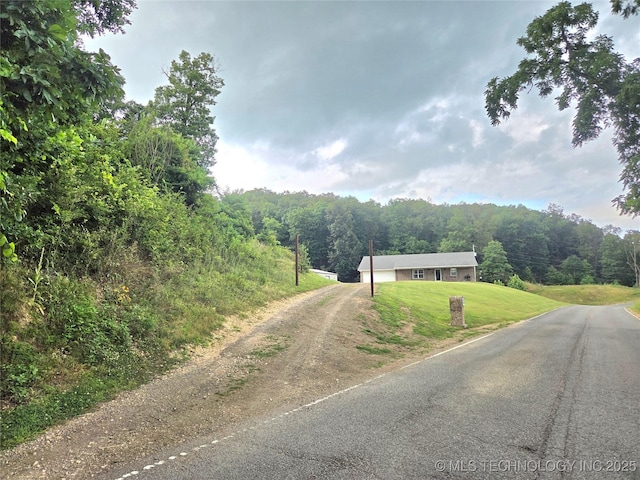 76654 S 4695, Stilwell, OK 74960 - view of asphalt driveway featuring a wooded view