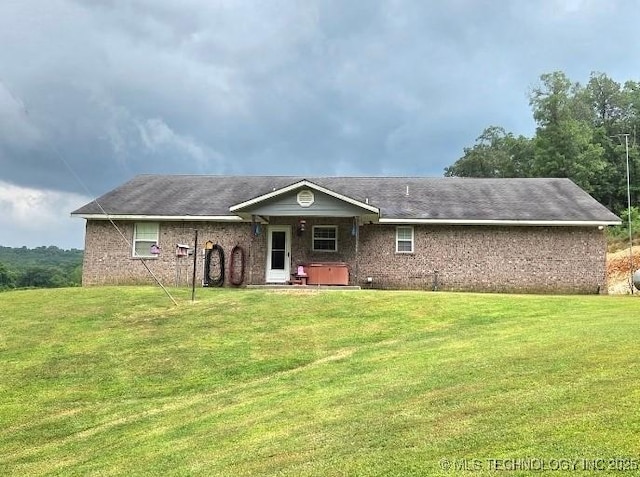 76654 S 4695, Stilwell, OK 74960 - view of front facade featuring a front yard and brick siding