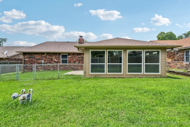 106 E 21st St, Owasso, OK 74055 - back of house featuring a chimney