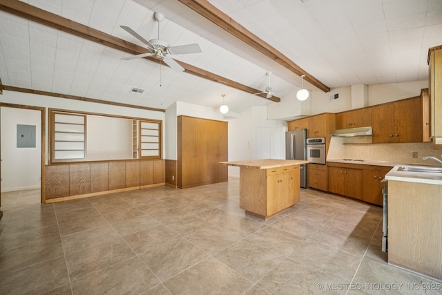 1234 S 101st E Ave, Tulsa, OK 74128 - kitchen with stainless steel appliances, a kitchen island, under cabinet range hood, ceiling fan, and wooden counters