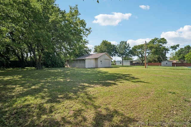 1234 S 101st E Ave, Tulsa, OK 74128 - view of yard with a garage and an outbuilding
