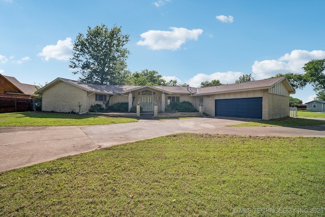 1234 S 101st E Ave, Tulsa, OK 74128 - ranch-style house featuring driveway, brick siding, a garage, and board and batten siding