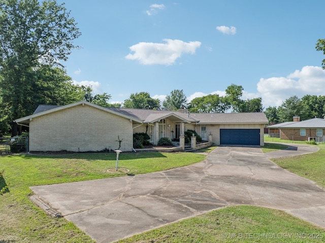 1234 S 101st E Ave, Tulsa, OK 74128 - view of front of property featuring brick siding, concrete driveway, and a garage