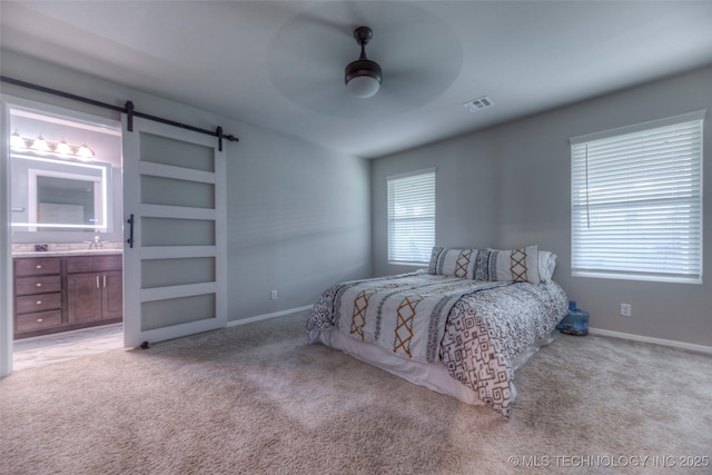 3711 S 151st E Ave, Tulsa, OK 74134 - bedroom featuring carpet, a barn door, connected bathroom, and ceiling fan