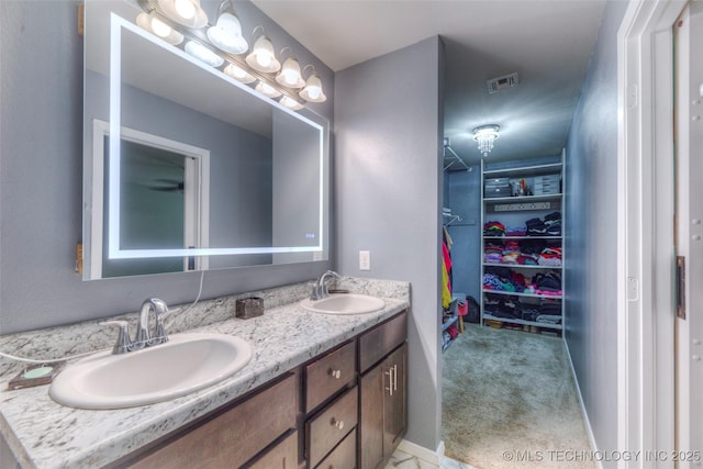 3711 S 151st E Ave, Tulsa, OK 74134 - full bathroom with double vanity and a spacious closet