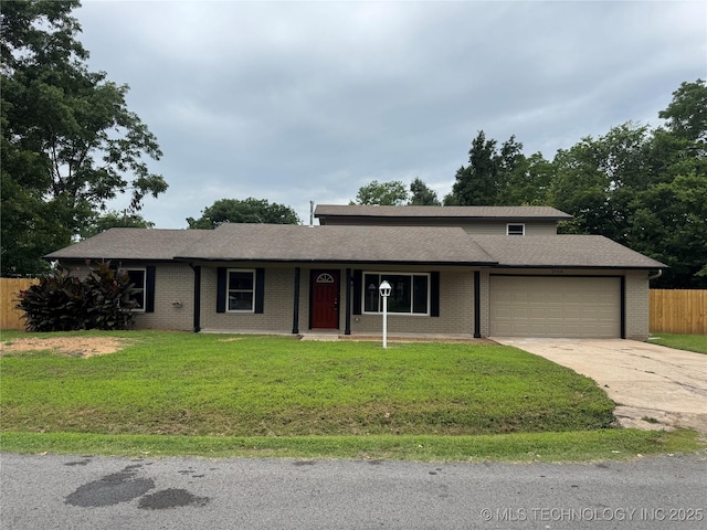 1704 Town And Country Rd, Sand Springs, OK 74063 - view of front of home featuring a garage, concrete driveway, brick siding, and a shingled roof