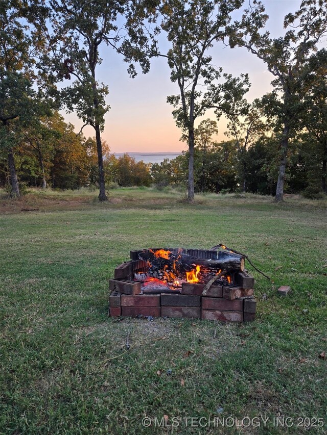 504 Blocker Rd, Mcalester, OK 74501 - view of grassy yard featuring a fire pit