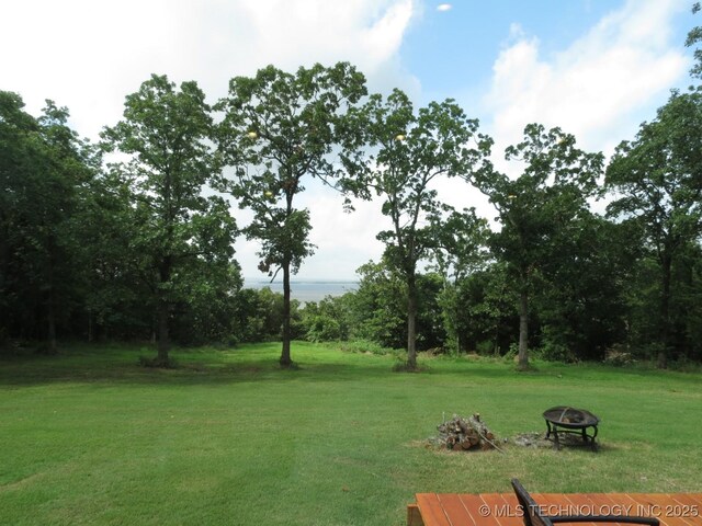 504 Blocker Rd, Mcalester, OK 74501 - view of grassy yard with a fire pit