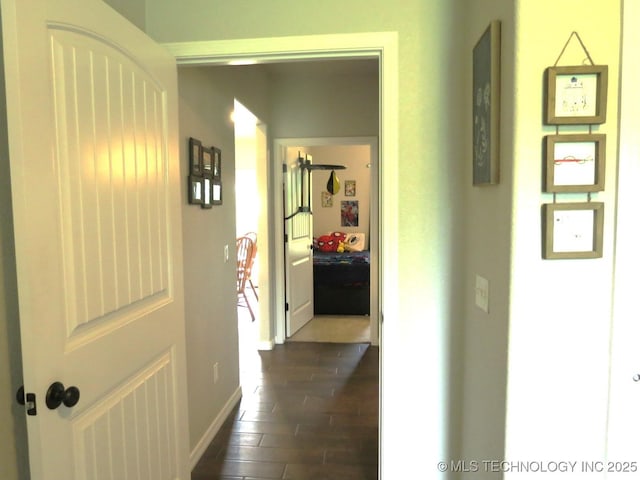 504 Blocker Rd, Mcalester, OK 74501 - hall featuring dark wood finished floors and baseboards