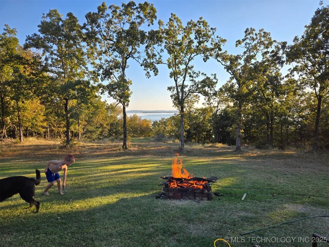 504 Blocker Rd, Mcalester, OK 74501 - view of grassy yard with an outdoor fire pit