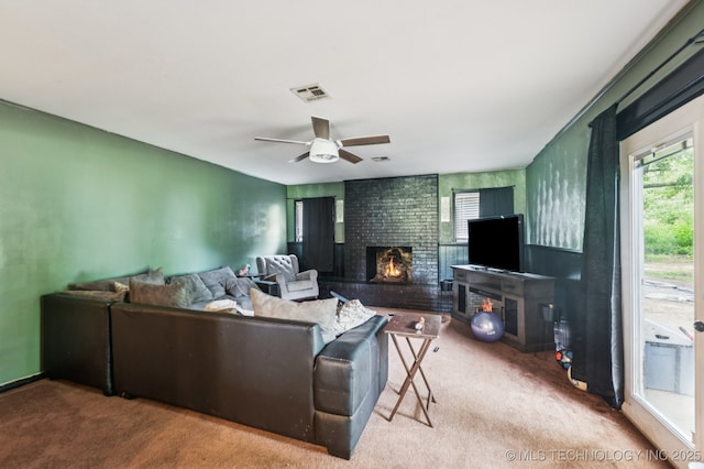 2548 Tull Pl, Muskogee, OK 74403 - carpeted living room with healthy amount of natural light, a brick fireplace, and ceiling fan