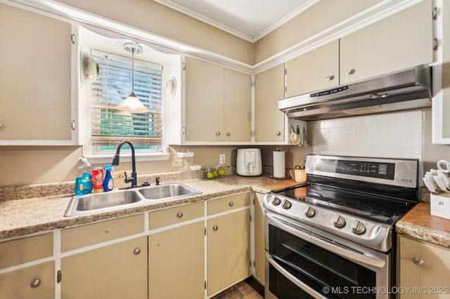 2548 Tull Pl, Muskogee, OK 74403 - kitchen featuring range with two ovens, under cabinet range hood, ornamental molding, light countertops, and cream cabinetry