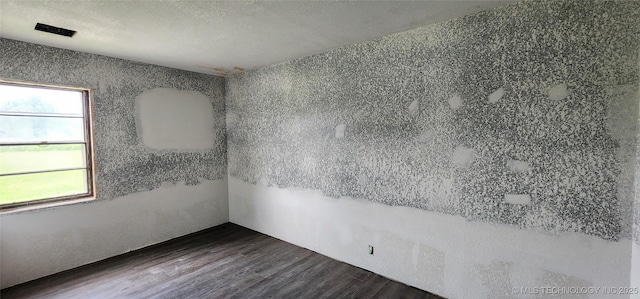 14505 S 145th E Ave, Bixby, OK 74008 - empty room featuring wood finished floors and a textured ceiling