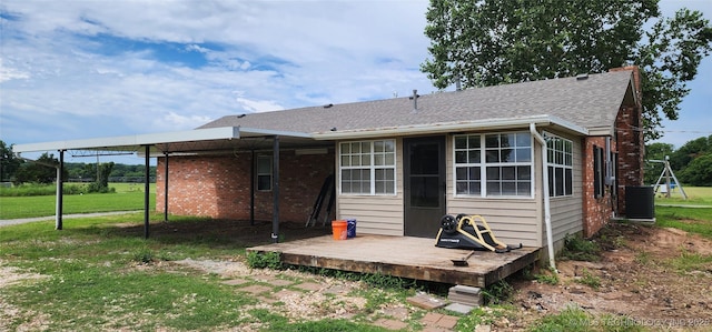14505 S 145th E Ave, Bixby, OK 74008 - back of house with a lawn, brick siding, and roof with shingles