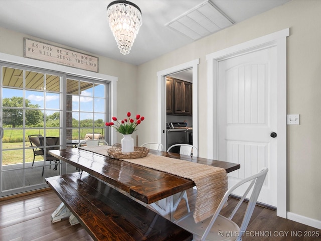 16145 Ew 255 Rd, Nowata, OK 74048 - dining room with washer and dryer, a chandelier, and dark wood-style flooring