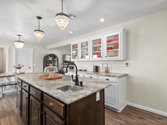 16145 Ew 255 Rd, Nowata, OK 74048 - kitchen featuring a chandelier, white cabinetry, dark wood-style flooring, pendant lighting, and recessed lighting