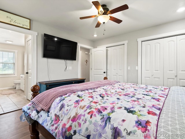 16145 Ew 255 Rd, Nowata, OK 74048 - bedroom with two closets, recessed lighting, ceiling fan, wood finished floors, and connected bathroom