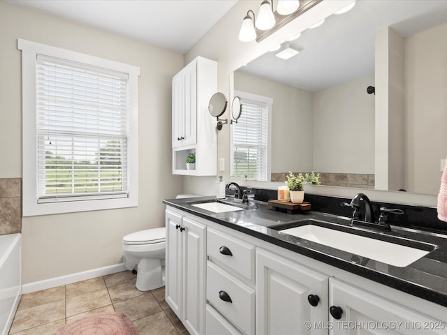16145 Ew 255 Rd, Nowata, OK 74048 - full bathroom with plenty of natural light, double vanity, a tub, and tile patterned floors