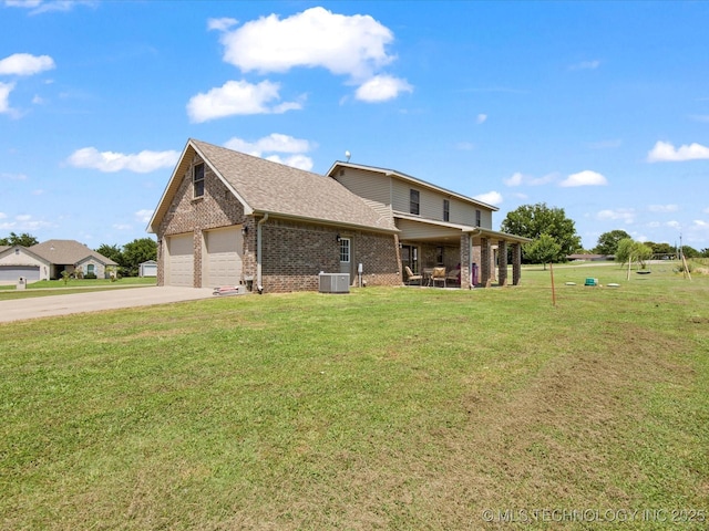 16145 Ew 255 Rd, Nowata, OK 74048 - view of side of property with brick siding, concrete driveway, a garage, a yard, and a shingled roof