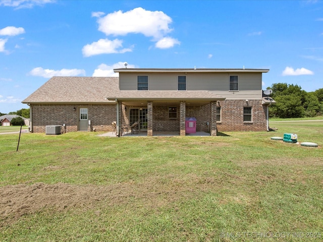 16145 Ew 255 Rd, Nowata, OK 74048 - rear view of house with a patio area, brick siding, a yard, and a shingled roof