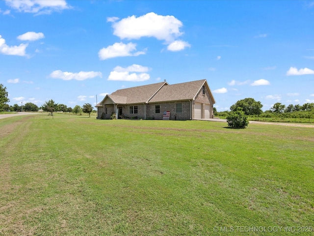 16145 Ew 255 Rd, Nowata, OK 74048 - view of front of home featuring a front lawn, driveway, an attached garage, and brick siding