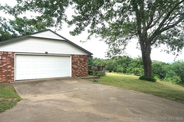 710 N 14th St, Henryetta, OK 74437 - garage with concrete driveway
