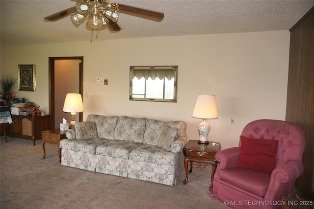 710 N 14th St, Henryetta, OK 74437 - living room featuring a ceiling fan, carpet floors, and a textured ceiling