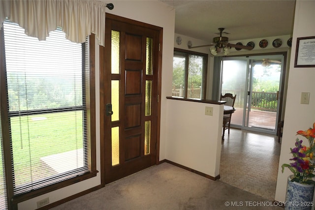 710 N 14th St, Henryetta, OK 74437 - entryway with a ceiling fan and light colored carpet