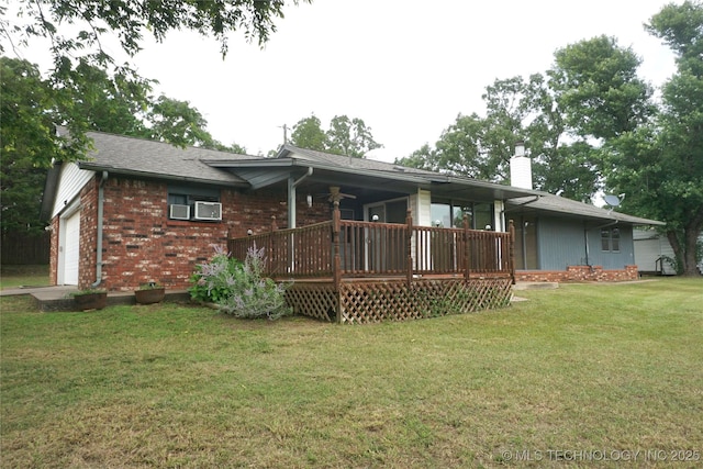 710 N 14th St, Henryetta, OK 74437 - back of house with a chimney, a yard, an attached garage, and brick siding