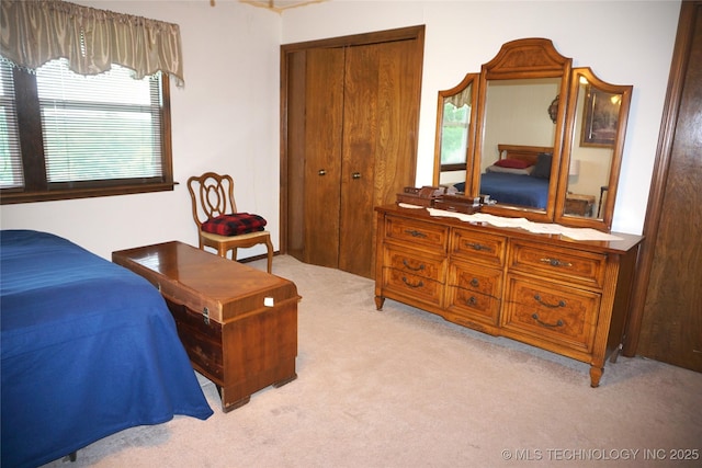 710 N 14th St, Henryetta, OK 74437 - bedroom featuring light colored carpet and a closet