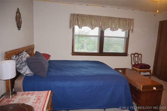 710 N 14th St, Henryetta, OK 74437 - bedroom featuring a textured ceiling