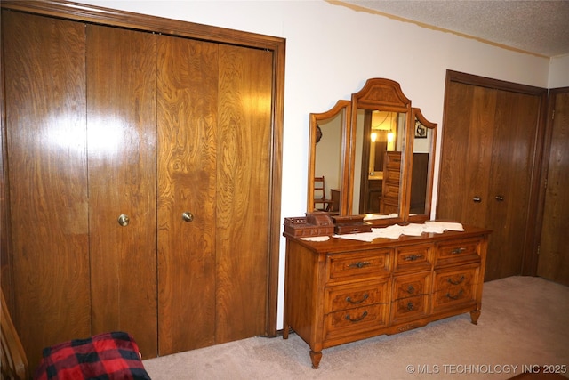 710 N 14th St, Henryetta, OK 74437 - bedroom with light colored carpet and a textured ceiling