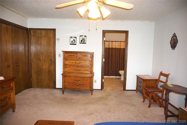 710 N 14th St, Henryetta, OK 74437 - bedroom with light colored carpet, a textured ceiling, and ensuite bathroom