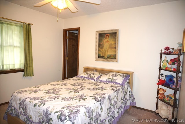 710 N 14th St, Henryetta, OK 74437 - bedroom featuring carpet flooring and a ceiling fan