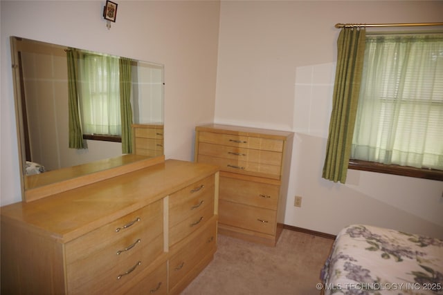 710 N 14th St, Henryetta, OK 74437 - bedroom with light colored carpet and baseboards
