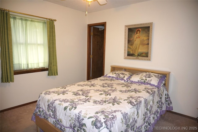 710 N 14th St, Henryetta, OK 74437 - bedroom with carpet flooring and baseboards