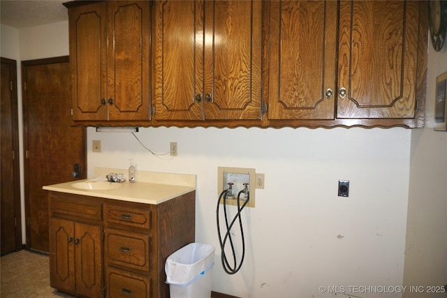710 N 14th St, Henryetta, OK 74437 - washroom with hookup for a washing machine, hookup for an electric dryer, and cabinet space