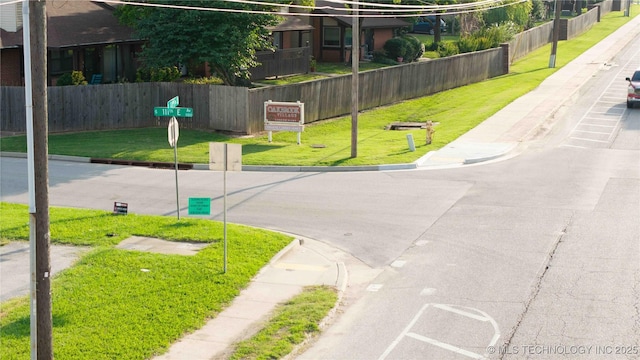 11030 E 11th Pl Unit 4A, Tulsa, OK 74128 - view of asphalt street with sidewalks and curbs
