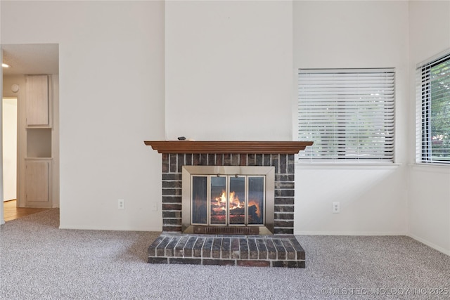 11030 E 11th Pl Unit 4A, Tulsa, OK 74128 - detailed view of a brick fireplace and carpet flooring