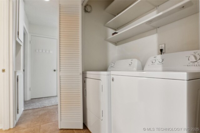 11030 E 11th Pl Unit 4A, Tulsa, OK 74128 - washroom featuring separate washer and dryer