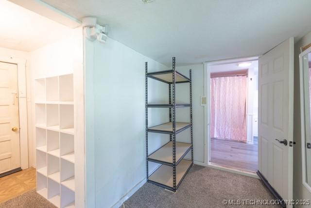 604 N N W, Konawa, OK 74849 - walk in closet featuring carpet flooring