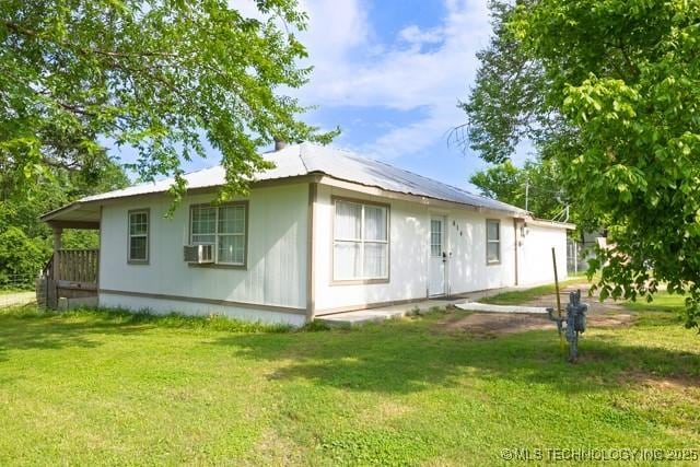 604 N N W, Konawa, OK 74849 - rear view of house featuring a yard and cooling unit